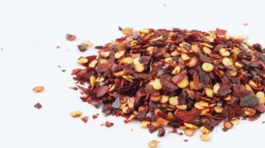 Dried chili flakes isolated on white background