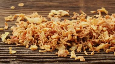 Dry minced onion on a wooden table