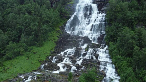 Waterfall in mountains. Outdoor nature in Norway