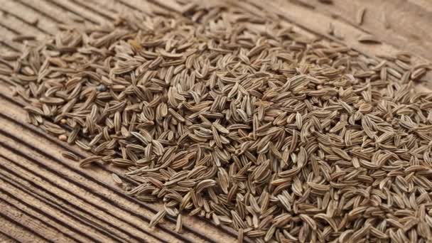 Aromatic Cumin Dry Seeds Texture Wooden Table — Stockvideo