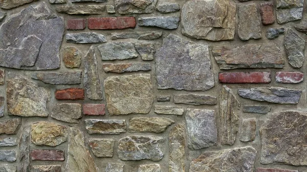 Τοίχος Τοιχοποιίας Από Πολύχρωμες Πέτρες Όγκους — Φωτογραφία Αρχείου