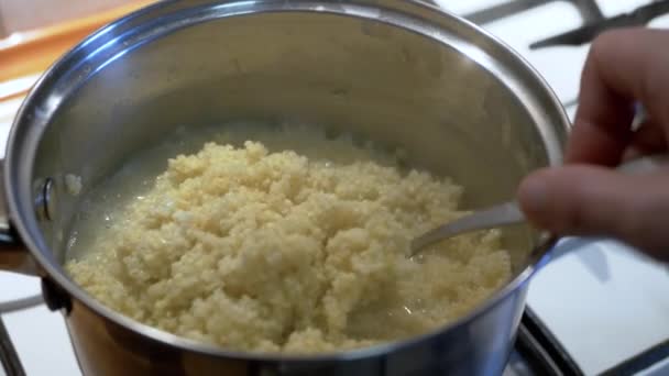 Chef Stirring Cooked Millet Porridge Saucepan Stove Spoon Home Kitchen — Stock Video