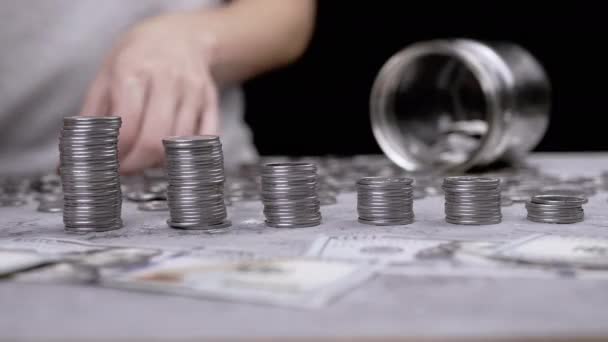 Hands Building Coin Tower Stack Background Scattered Money Glass Bank — Vídeos de Stock