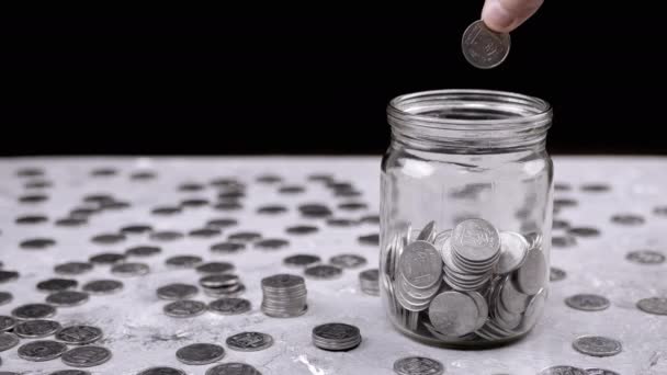 Hand Throws One Five Kopeck Ukrainian Coin Glass Jar Filled — Vídeos de Stock