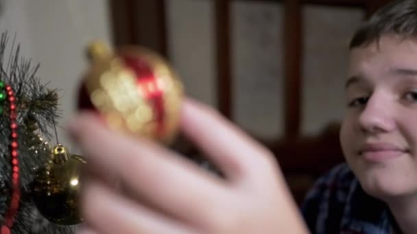 Smiling Boy Examines Nice Shiny Hanging Christmas Tree Toys Christmas — Stock Video