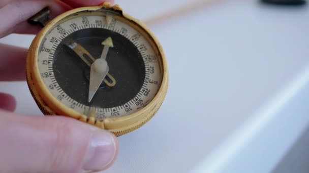 Woman Examining Old Dirty Dusty Compass Her Hand Indoors Uma — Vídeo de Stock