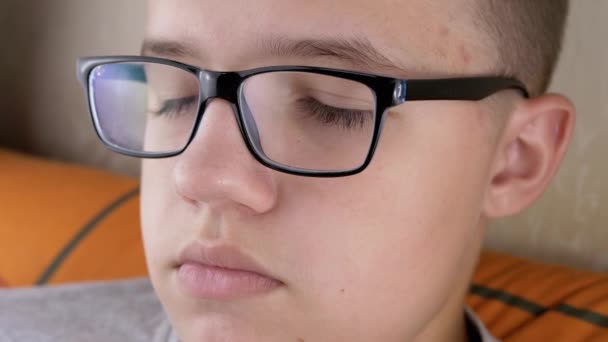 Face Teenager Glasses Long Eyelashes Who Blinks Closes His Eyes — Vídeos de Stock