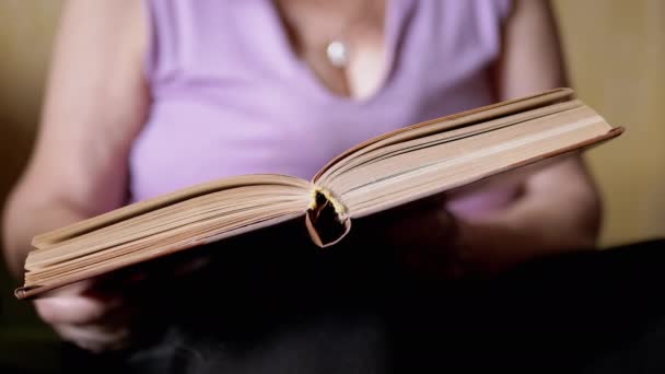 Elderly Woman Reading Book Rays Sunlight Indoors Close Open Book — Stock Video
