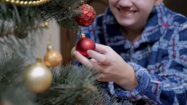 Smiling Boy Examines Nice Shiny Hanging Christmas Tree Toys Christmas — Stock Video