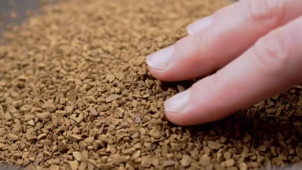 Female Hand Touches Fingers Granules Loose Instant Coffee Pile Close — Vídeo de stock