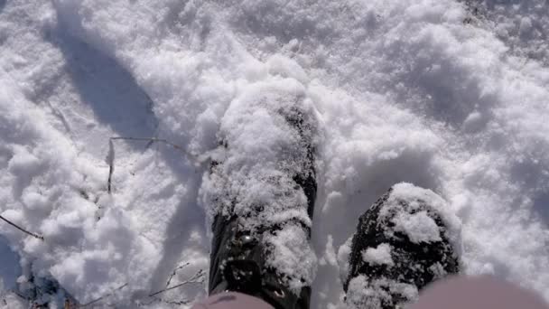 Top View Woman Shakes Snow Black Boots While Standing Snowdrift — Vídeo de Stock