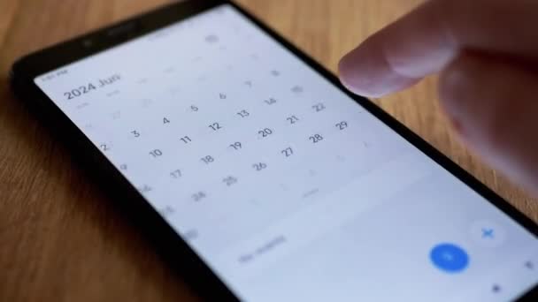 Female Finger Scrolling Calendar App Mobile Phone Screen Looking Date — стокове відео
