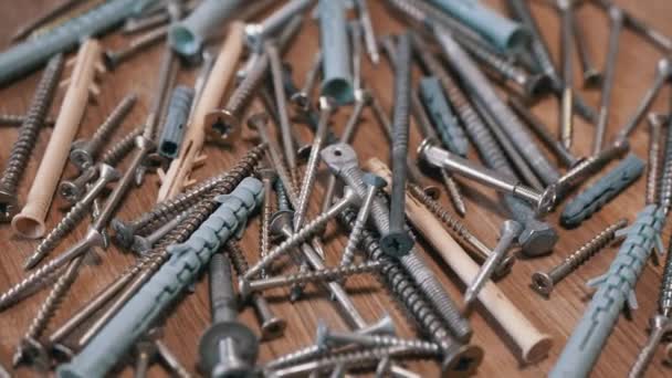 Lots Scattered Stainless Steel Fasteners Rotating Wooden Background Close Abundance — Stock Video