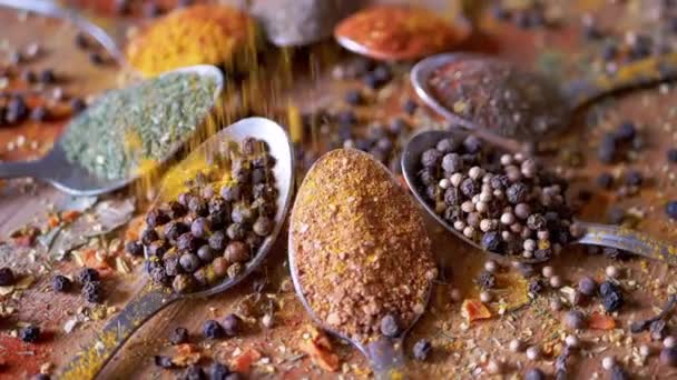 Falling Dry Spices Spoons Colorful Spices Rotating Wooden Background Abundance — Stock Video