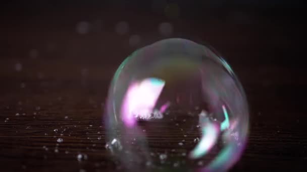 Close Lots Colorful Stuck Together Soap Bubbles Brown Wooden Surface — Stock Video