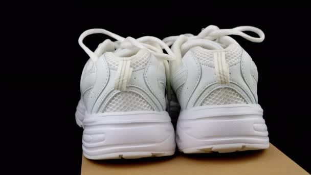 Ukraine Kamenskoe 2023 Pair White Leather Sneakers Rotate Cardboard Box — Stock Video