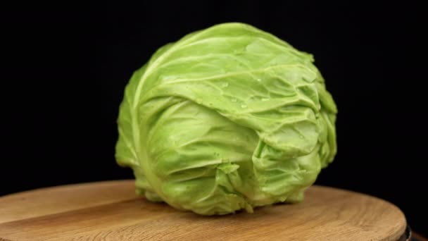 Green Head Cabbage Water Drops Rotate Turntable Black Background Close — Stockvideo