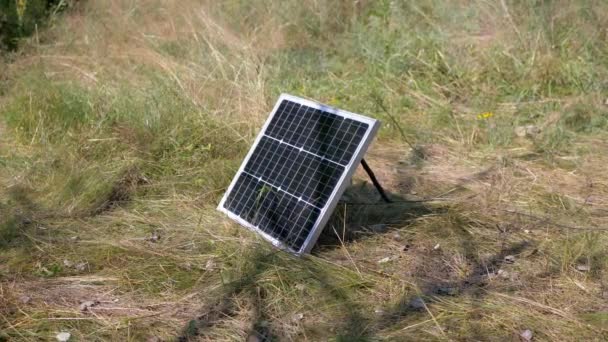 One Small Portable Photovoltaic Solar Panel Installed Grass Nature Black — Stock Video
