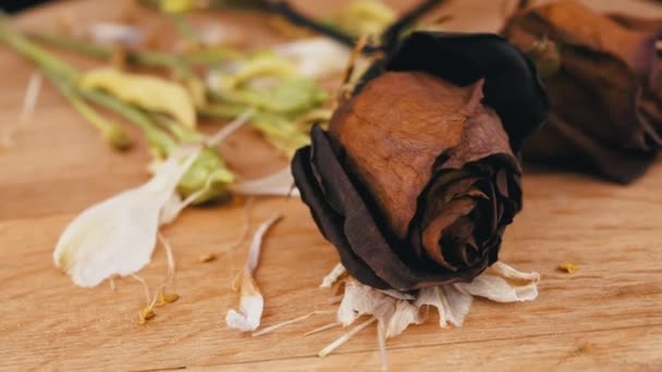 Close Bouquet Dried Red Roses Slowly Rotates Wooden Background Composition — Stock Video