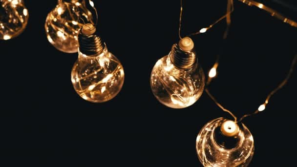 Lots Hanging Glowing Vintage Edison Light Bulbs Black Background Top — Stock Video