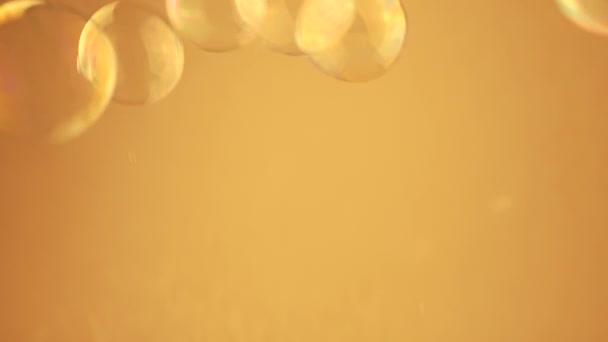 Close Lot Colorful Soap Bubbles Moving Orange Background Empty Space — Stock Video