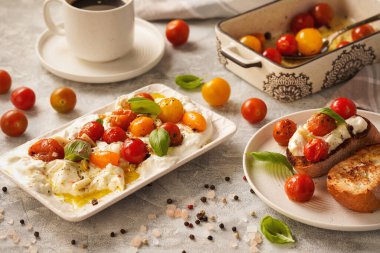 Lunch idea - burrata cheese with baked tomatoes and toasts.  