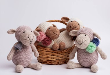 Handmade knitted toys sheep, amigurumi. Handmade soft toy. clipart