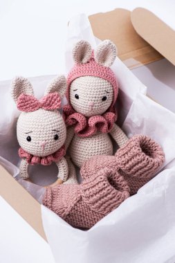 Variety of knitted toys. Bunny and baby booties. Handmade soft toys. clipart