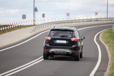A car driving on an empty road