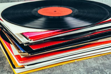 stack of vinyl records with music