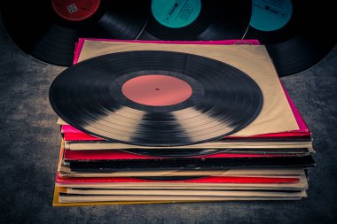 stack of vinyl records with music