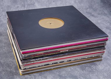 stack of vinyl records with music
