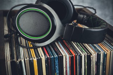 Vinyl records and headphones in retro style