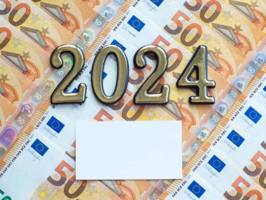 Set of European Union money with a face value of 50 euros. Background of the fifty euros banknotes and 2024 with copy space. Enterprise capital investment, finance, savings, bank and New Year concept