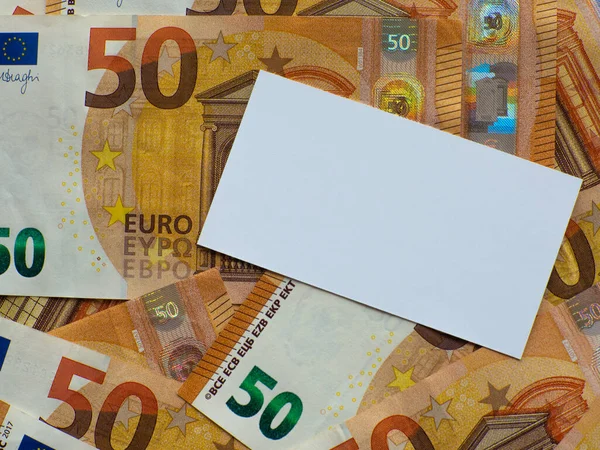 A set of European Union money with a face value of 50 euros. Background of the fifty euros banknotes with white copy space. Enterprise capital investment, finance, savings, corruption and bank concept