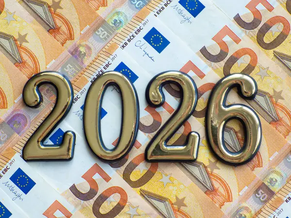 Set of European Union money with a face value of 50 euros. Background of the fifty euros banknotes and 2026 with copy space. Enterprise capital investment, finance, savings, bank and New Year concept