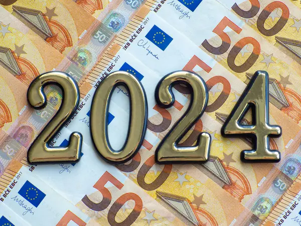 Set of European Union money with a face value of 50 euros. Background of the fifty euros banknotes and 2024 with copy space. Enterprise capital investment, finance, savings, bank and New Year concept