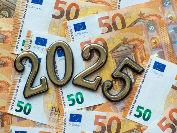 Set of European Union money with a face value of 50 euros. Background of the fifty euros banknotes and 2025 with copy space. Enterprise capital investment, finance, savings, bank and New Year concept
