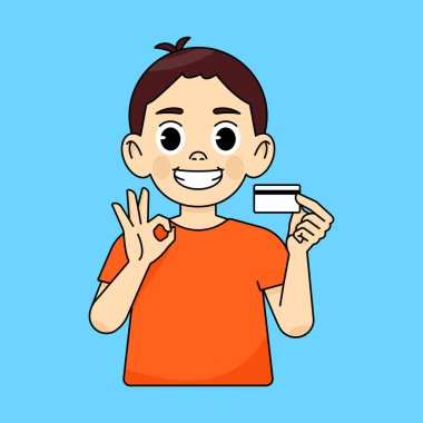 Çocuk plastik kredi kartı tavsiye ediyor ve tutuyor, diğer el de tamam işareti gösteriyor.