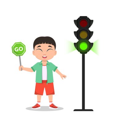 Çocuğun elinde bir işaret var. Trafik ışığı yeşil ışık gösteriyor..