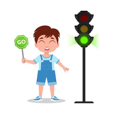 Çocuğun elinde bir işaret var. Trafik ışığı yeşil ışık gösteriyor..