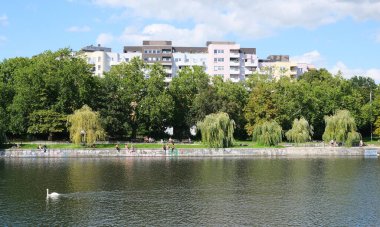Berlin, Germany, August 10, 2023, summer view over the Landwehrkanal to the housing estate at Boecklerpark clipart
