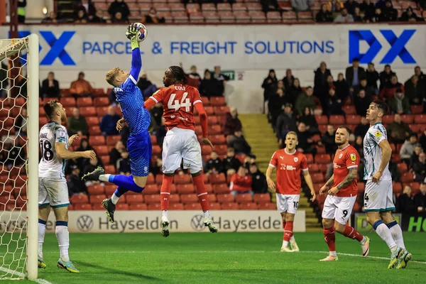 stock image Carl Rushworth #1 of Lincoln City saves a cross as Devante Cole #44 of Barnsley pressures during the Sky Bet League 1 match Barnsley vs Lincoln City at Oakwell, Barnsley, United Kingdom, 25th October 202