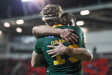 Avustralyalı Campbell Graham, Wicked Stadyumu, St Helens, Birleşik Krallık 'ta oynanan 2021 Dünya Rugby Ligi karşılaşmasında denemesini kutluyor.