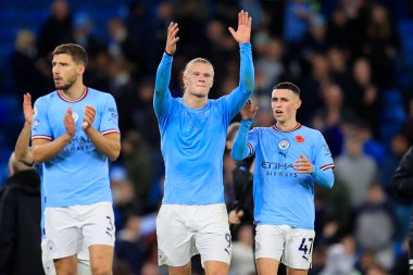 Erling Haaland #9 and Phil Foden #47 of Manchester City celebrate the 2-1 victory at the end of the Premier League match Manchester City vs Fulham at Etihad Stadium, Manchester, United Kingdom, 5th November 202 clipart