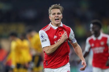 Martin degaard # 8 Arsenal Premier League maçında Wolverhampton Wanderers, Molineux, Wolverhampton, Birleşik Krallık 'ta 12 Kasım 2022' de Arsenal 'e karşı 0-1' lik galibiyetini kutluyor.