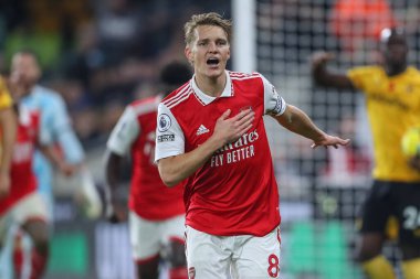 Martin degaard # 8 Arsenal Premier League maçında Wolverhampton Wanderers, Molineux, Wolverhampton, Birleşik Krallık 'ta 12 Kasım 2022' de Arsenal 'e karşı 0-1' lik galibiyetini kutluyor.