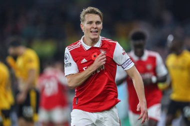 Martin degaard # 8 Arsenal Premier League maçında Wolverhampton Wanderers, Molineux, Wolverhampton, Birleşik Krallık 'ta 12 Kasım 2022' de Arsenal 'e karşı 0-1' lik galibiyetini kutluyor.
