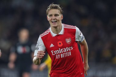 Martin degaard # 8 Arsenal Premier League maçında Wolverhampton Wanderers, Molineux, Wolverhampton, Birleşik Krallık 'ta 12 Kasım 2022' de Arsenal 'e karşı 0-2' lik galibiyet golünü kutluyor.