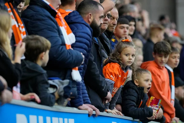 stock image A you8ng Blackpool  fan watches on during the Sky Bet Championship match Wigan Athletic vs Blackpool at DW Stadium, Wigan, United Kingdom, 12th November 202